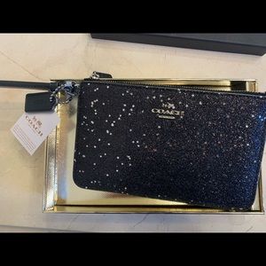 coach star glittery wristlet